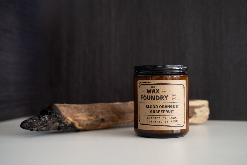 Candle jar from The Wax Foundry with a label on a dark background
